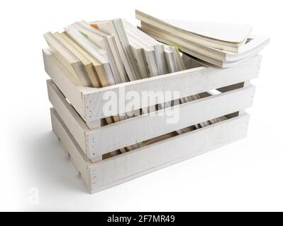 Wooden box of fruit (apples) in white full of magazines and books, ready to go. Isolated on white background. Side view. Stock Photo