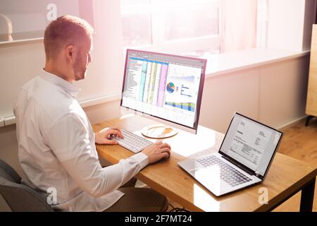 Spreadsheet Analyst Employee Worker. Medical Report On Computer Stock Photo