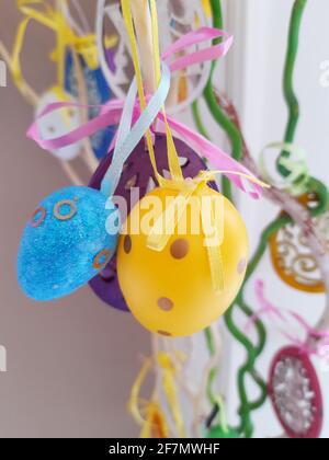 On the eve of Easter, festive decorations in the form of colorful Easter eggs. Stock Photo