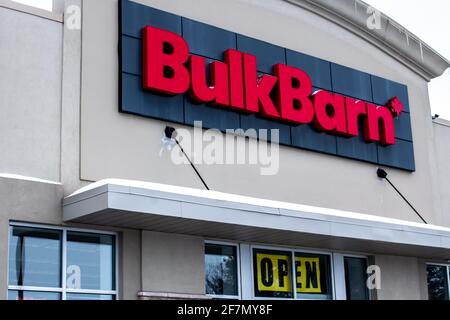 London, Ontario, Canada - February 15 2021: The exterior of a Bulk Barn store of the Bulk Barn franchise with icicles hanging off its rooftop. Stock Photo