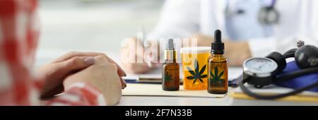 Doctor writes prescription for patient for marijuana. Stock Photo