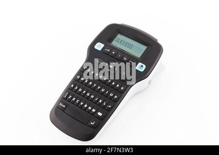 Handheld Label Printer with Success Word on The Screen. Isolated on White Background. Stock Photo