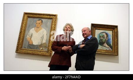 Matisse and Picasso......at the Tate Modern 11 May-18 August 2002... Curators of exhibition Elizabeth Cowling and John Golding with self portraits of the two artists survey the exhibition.pic David Sandison 6/5/2002 Stock Photo