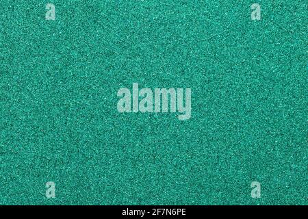 Metallic glitter green-blue aquamarine wrapping paper background, close-up, macro. Copy space for text. Horizontal and vertical. Celebration, holidays Stock Photo