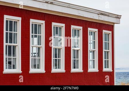 Window details of the Glen Haven Canning Co. building, now the Great Lakes Boathouse Museum, in historic Glen Haven Village in Sleeping Bear Dunes Nat Stock Photo