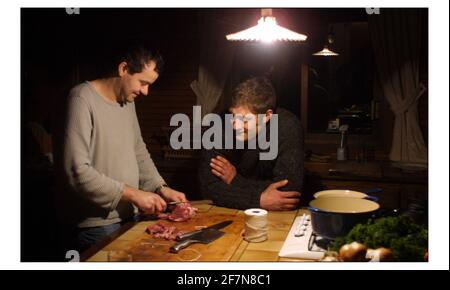 Wild Boar hunting at 'CHASSE DE LA LOIRE' in France....Chef Director of Caprice Holdings Ltd. Mark Hix,  preparing Wild Boar Rack of ribs, with Niels Bryan-Low in the kitchen of the lodge.pic David Sandison 2/3/2003 Stock Photo