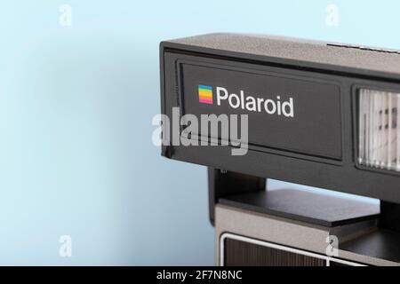 OURENSE, SPAIN - APRIL 08, 2021: Retro Polaroid instant camera on blue background. Stock Photo