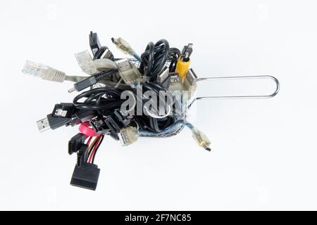 technological waste that remains in residence as computer cables Stock Photo