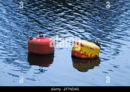 Two buoys floating in the River Dee, Chester on a late spring evening Stock Photo
