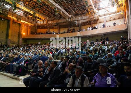 The audience during a performance by the Watar orchestral, playing for the first time on the grounds of the Spring Theatre Hall, which was destroyed during the ISIS occupation in the city.The Watar orchestral includes 36 young men and women from different denominations of Nineveh Governorate, including Muslims, Christians and Yazidis, whose ages range between 8-32 years. Stock Photo