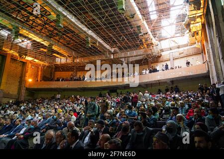 Mosul, Iraq. 08th Apr, 2021. The audience during a performance by the Watar orchestral, playing for the first time on the grounds of the Spring Theatre Hall, which was destroyed during the ISIS occupation in the city.The Watar orchestral includes 36 young men and women from different denominations of Nineveh Governorate, including Muslims, Christians and Yazidis, whose ages range between 8-32 years. (Photo by Ismael Adnan/SOPA Images/Sipa USA) Credit: Sipa USA/Alamy Live News Stock Photo