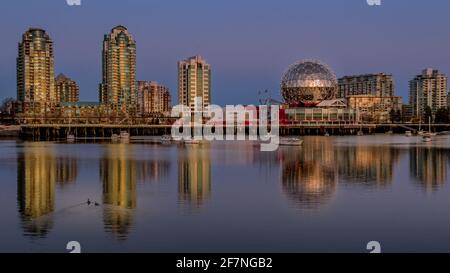 Vancouver Skyline at Sunset at the Eastern Shore of False Creek Inlet with the Science Center Globe in British Columbia, Canada Stock Photo