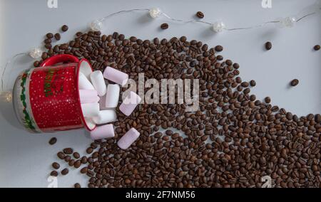 red glass with sweets on the background of coffee beans Stock Photo