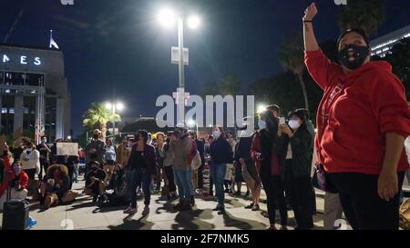 Los Angeles, CA, USA. 8th Apr, 2021. A crowd gathers on Thursday night for a 'Housing not Cops' protest in front of the Los Angeles Police Headquarters. They came together to speak out against residential evictions and against the police department's budget. Credit: Young G. Kim/Alamy Live News Stock Photo