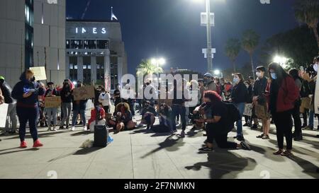 Los Angeles, CA, USA. 8th Apr, 2021. A crowd gathers on Thursday night for a 'Housing not Cops' protest in front of the Los Angeles Police Headquarters. They came together to speak out against residential evictions and against the police department's budget. Credit: Young G. Kim/Alamy Live News Stock Photo