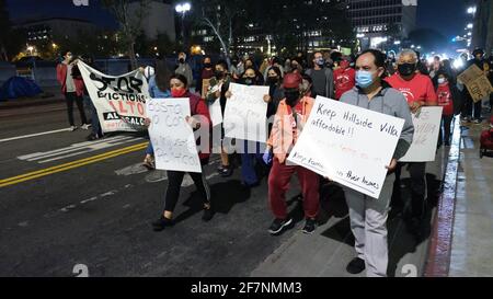 Los Angeles, CA, USA. 8th Apr, 2021. Protesters march from Los Angeles City Hall to the Los Angeles Police Department Headquarters on Thursday night for a 'Housing not Cops' protest. They came together to speak out against residential evictions and against the police department's budget. Credit: Young G. Kim/Alamy Live News Stock Photo