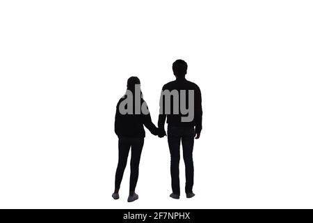 Rear of young couple holding hands with standing. isolated on white background Stock Photo