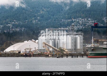 Oil refinery plant with tank and cargo ship at port in Vancouver sea Stock Photo