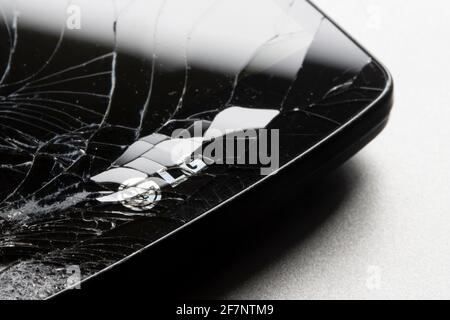 The LG logo is seen on a cracked smartphone on April 8, 2021. LG Electronics has confirmed its rumored exit from the competitive smartphone industry. Stock Photo