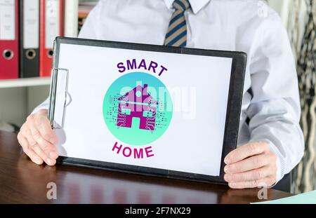 Smart home concept shown by a businessman Stock Photo