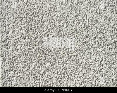 rough white wall textures with harsh sunlight highlighting the texture Stock Photo