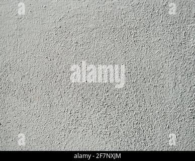 rough white wall textures with harsh sunlight highlighting the texture Stock Photo