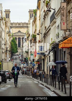 Paris, France - May 6th 2019: View along the lively Rue d'Hauteville Stock Photo