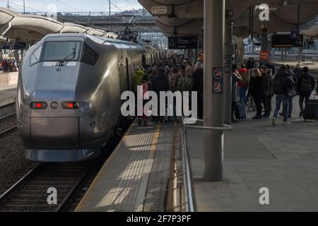 Passengers boarding the airport express train 'Flytoget' on Oslo Central Station heading for Oslo Airport Gardermoen Stock Photo