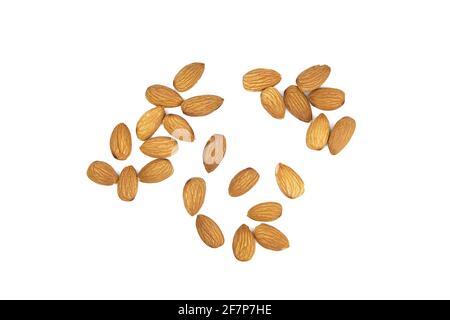 Almond nuts isolated on white background, top view. Scattered almonds Stock Photo