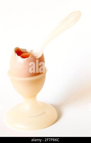 soft-boiled breakfast egg with an egg spoon in an egg cup Stock Photo