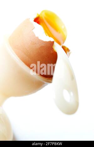 soft-boiled breakfast egg with an egg spoon in an egg cup Stock Photo
