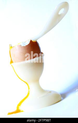 soft-boiled breakfast egg with an egg spoon in an egg cup Stock Photo