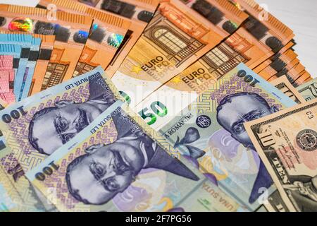 Selective focus on detail of EURO and LEI banknotes. Detail of European Union currency EURO banknotes and Romanian currency LEI. World money concept, Stock Photo