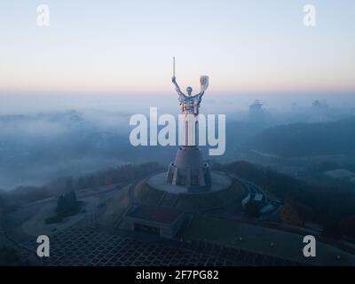 Kyiv, Ukraine - November 10 2018: Aerial view of Mother Motherland statue in Kyiv on early morming with fog from river Dnieper, Ukraine Stock Photo