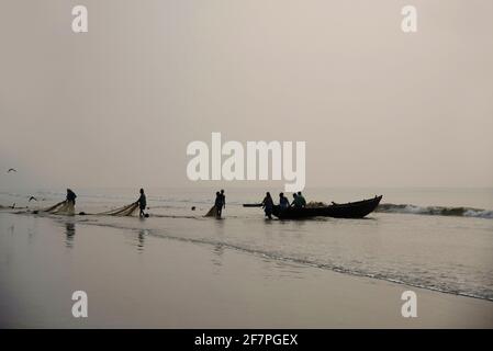 Collecting fishing nets at Digha Beach, West Bengal, India Stock Photo