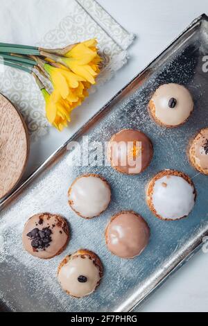 Delicious french Choux Craquelin pastries filled with cream Stock Photo