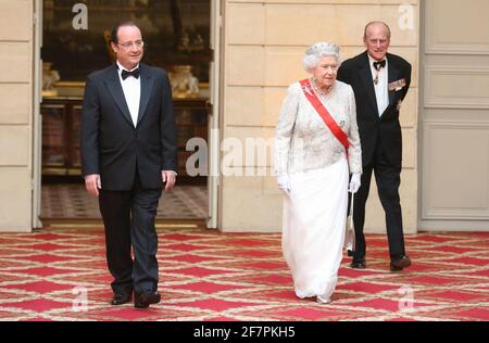 File - French President Francois Hollande Embraces German Chancellor 