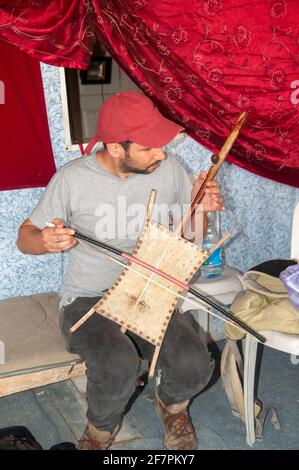 The rebab or rabab is the name of several related bowed string instruments that spread via Islamic trading routes over much of North Africa, Southeast Stock Photo