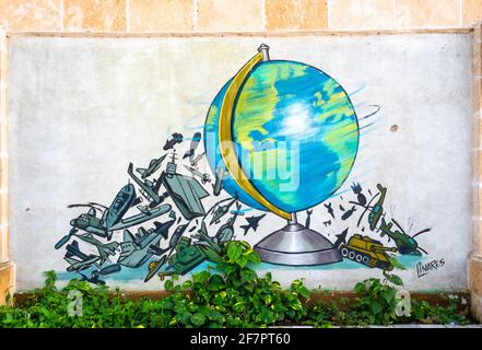 Peace theme cartoons in the city wall, Santa Clara, Cuba Stock Photo