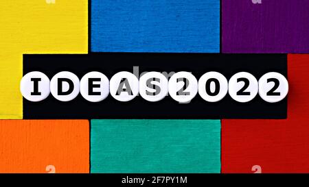 Photo on ideas theme. The word "ideas", and numbers "2022", on a colorful background. Motivation concept image Stock Photo