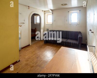 old living room in an abandoned boat Stock Photo