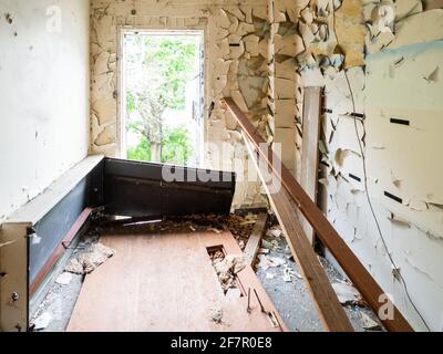 view of an abandoned room with peeling paint Stock Photo