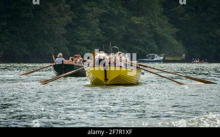 Women rowing in village Crabber boat race, Devon, UK Stock Photo