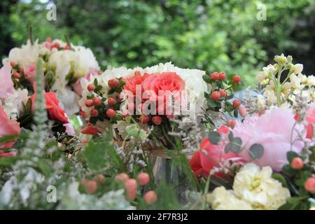 Beautiful bouquets of seaside themed wedding flowers including roses, berries and starfish are seen in Cape May, New Jersey in June. Stock Photo