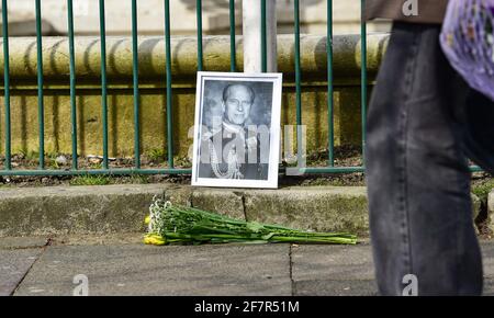 Brighton, UK. 9th Apr, 2021. A photograph of Prince Philip and flowers left at Brighton War Memorial after the announcement of his death today : Credit: Simon Dack/Alamy Live News Stock Photo
