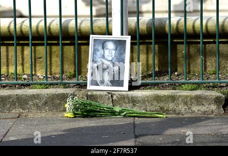 Brighton, UK. 9th Apr, 2021. A photograph of Prince Philip and flowers left at Brighton War Memorial after the announcement of his death today : Credit: Simon Dack/Alamy Live News Stock Photo