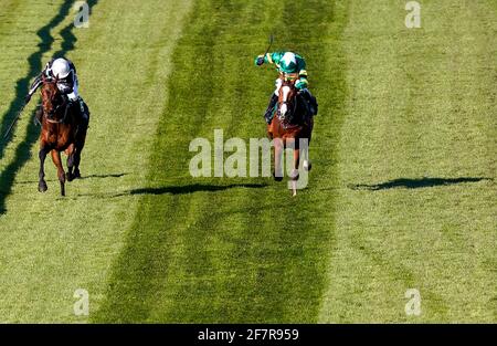 Rowland Ward ridden by Charlie Hammond (left) on their way to winning the Pinsent Masons Handicap Hurdle during Ladies Day of the 2021 Randox Health Grand National Festival at Aintree Racecourse, Liverpool. Picture date: Friday April 9, 2021. Stock Photo
