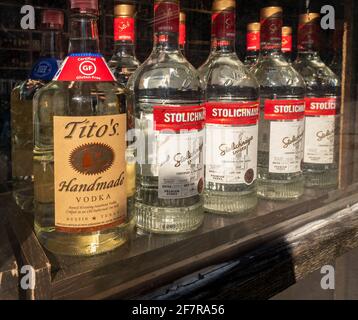 A selection of bottles of top shelf liquor displayed in the window of a store in Chelsea in New York on Tuesday, April 6, 2021.  (© Richard B. Levine) Stock Photo