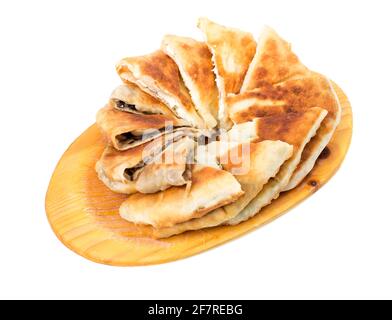 Delicious sliced puff pie stuffed with mushrooms and eggs. Isolated on a white background. Stock Photo
