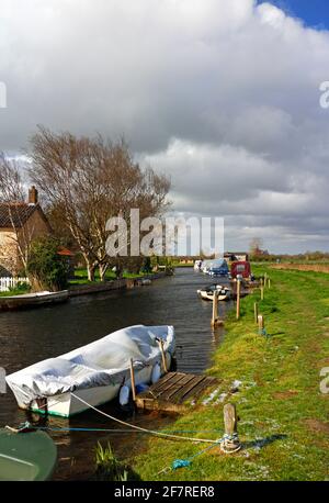 A view of the Staithe and dyke with moorings for small boats on the Norfolk Broads at West Somerton, Norfolk, England, United Kingdom. Stock Photo